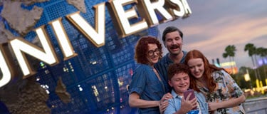 Family of 4 in front of Universal Studios Globe