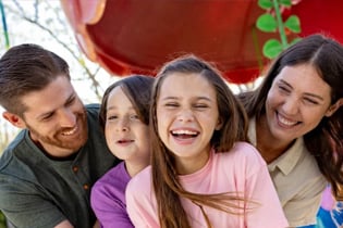 family laughing and smiling