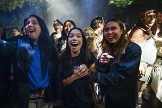 Three people celebrating Universal Fan Fest Nights
