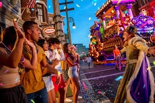 People celebrating Mardi Gras with hats and masks on