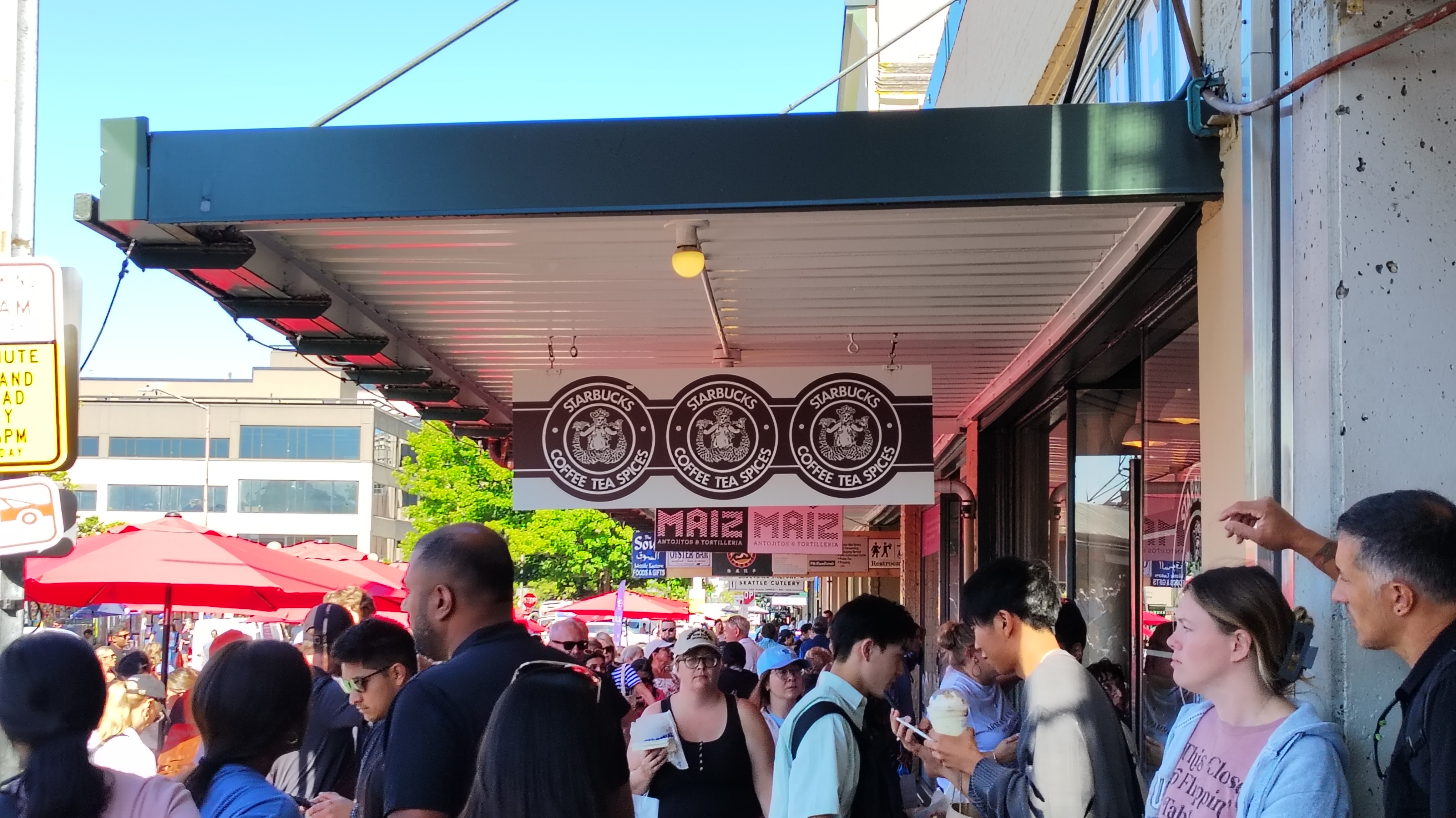 A sign depicting the original Starbucks' siren logo