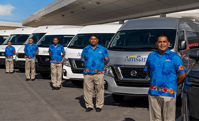 amstar staff and vans lined up on street