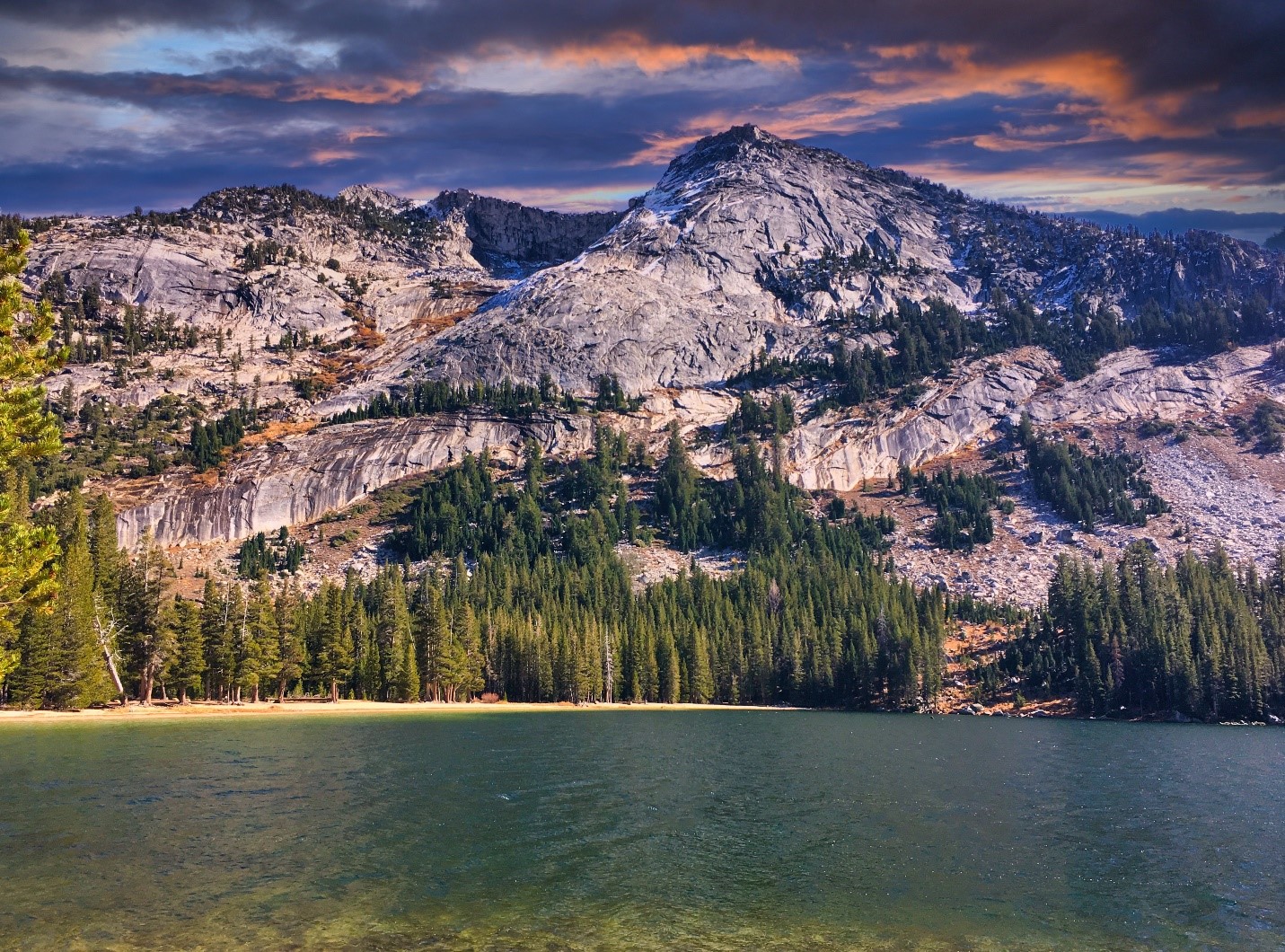 mountainous landscpae with trees and a lake