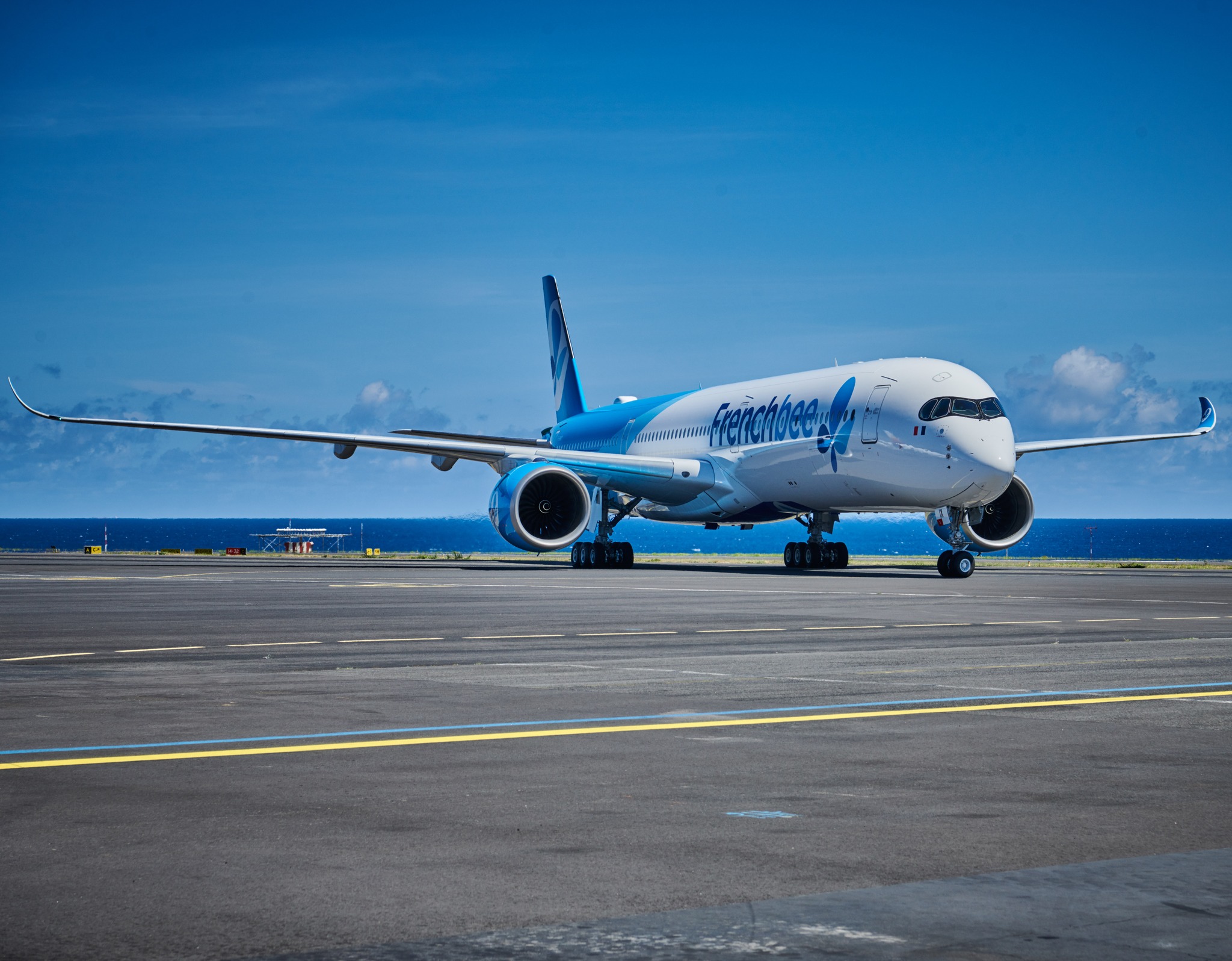 French bee airplane on a runway