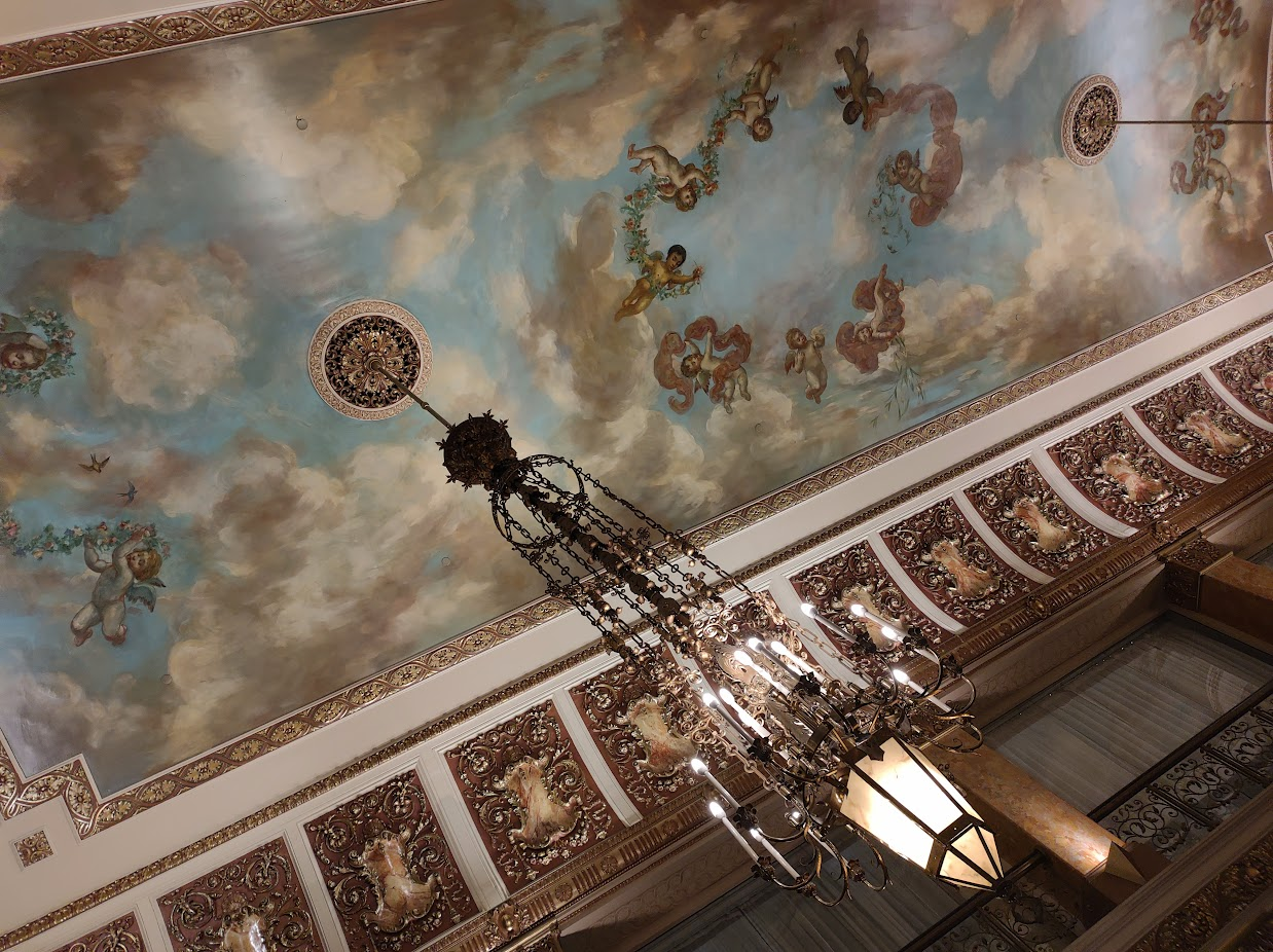 The ornate ceiling mural in the Pfister Hotel's lobby