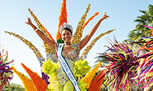 Woman in a colorful flowery dress at Carnival