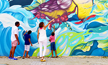 Family looking at colorful wall art