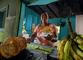 man pouring rum from a Bacardi barrel