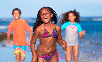 kids running and laughing on the beach